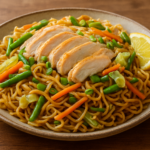 Filipino pancit canton noodles with chicken and vegetables