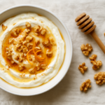Easy Greek yiaourti me meli recipe with creamy yogurt, honey, walnuts, cinnamon, and orange zest